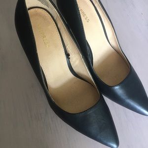 Black leather pumps